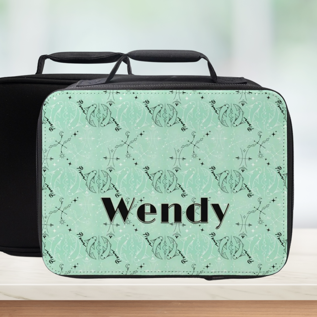 Green Pisces zodiac patterned lunch bag with 'Wendy' custom text on a blurred background