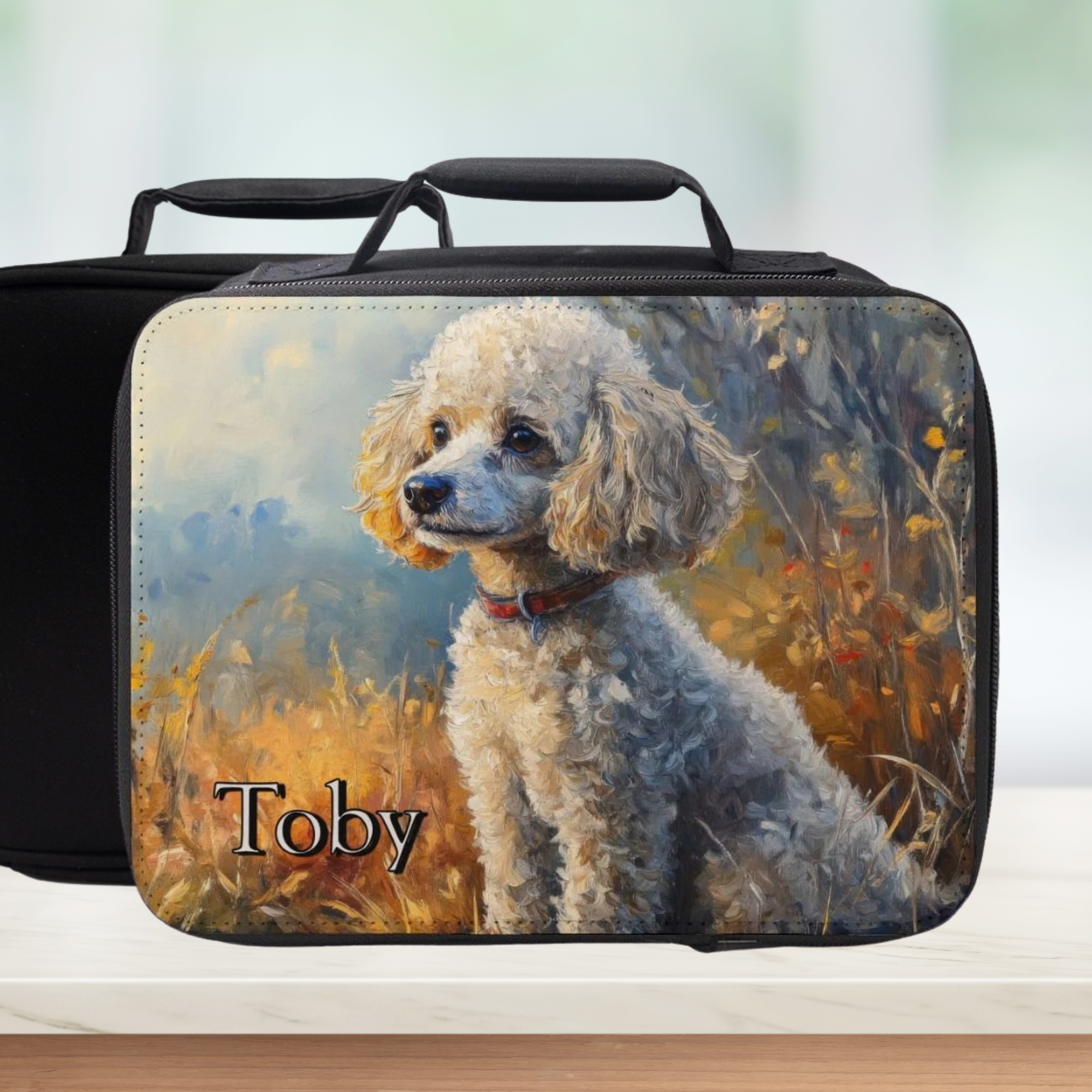 Black lunch bag with a poodle dog painting and 'Toby' custom text on a white background