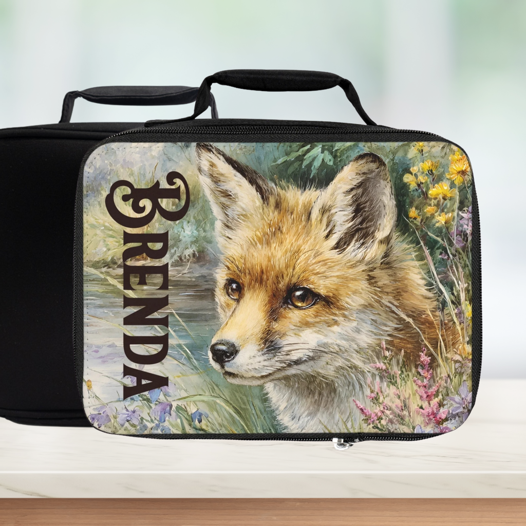 Lunch bag with a fox design and the name 'Brenda' on a blurred background