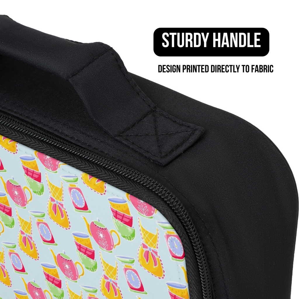 close up of a lunch bag with a colorful baking design on fabric and a black handle, labeled 'Sturdy Handle'.