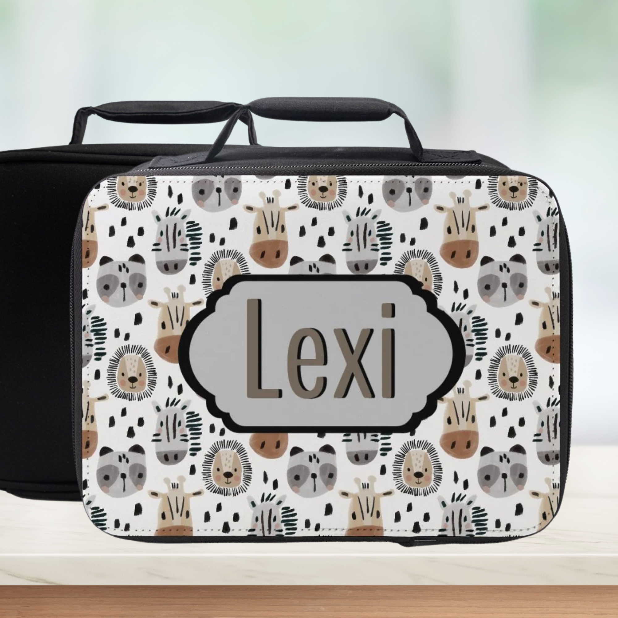  insulated lunch bag with animal pattern and 'Lexi' custom text on a wooden surface with a light background