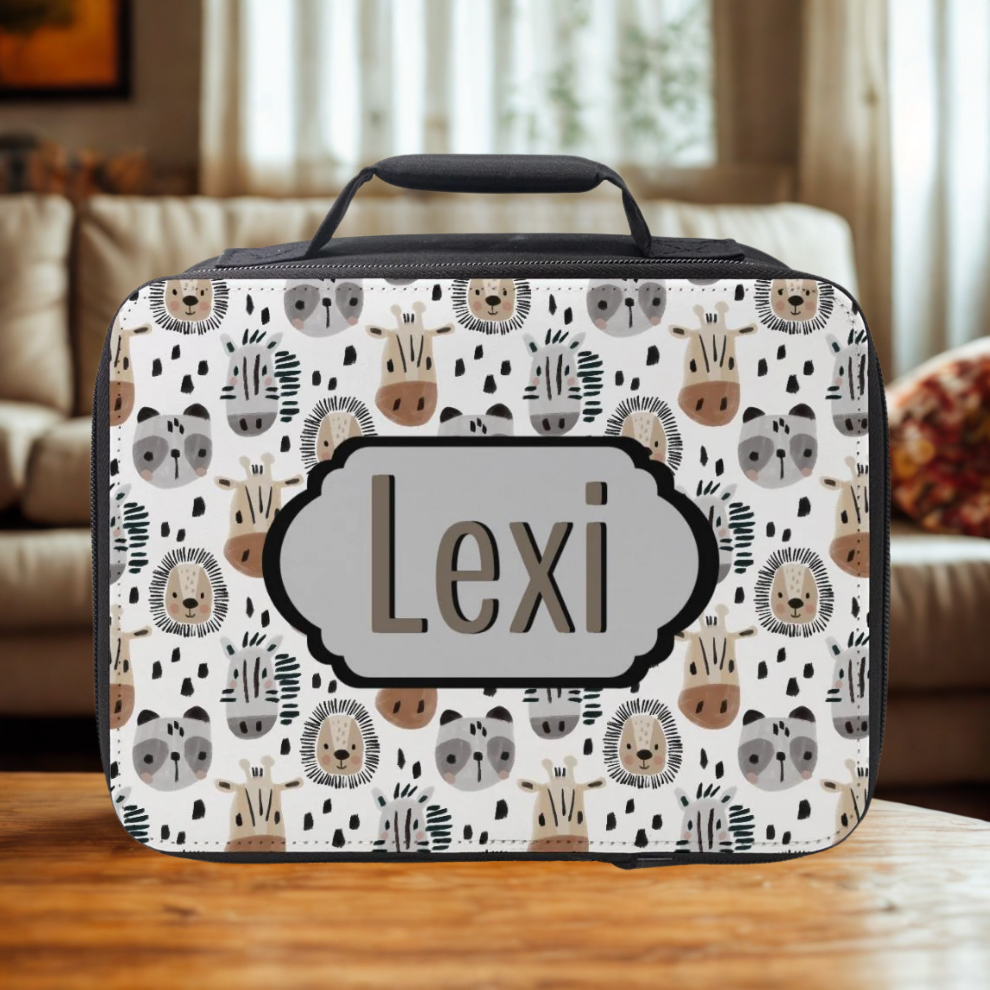 insulated lunch bag with animal pattern and 'Lexi' custom text on a wooden table in a living room