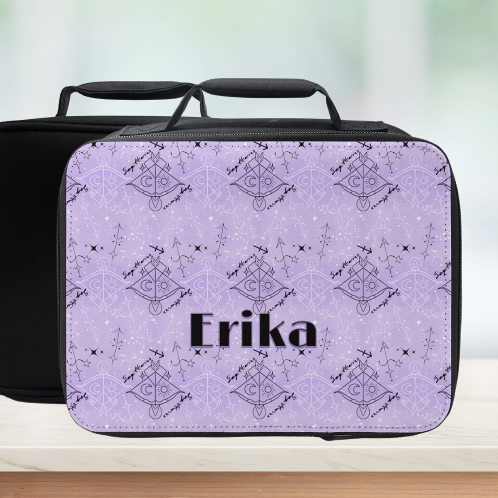 Black and purple Sagittarius zodiac patterned lunch bag with 'Erika' custom text on a blurred background