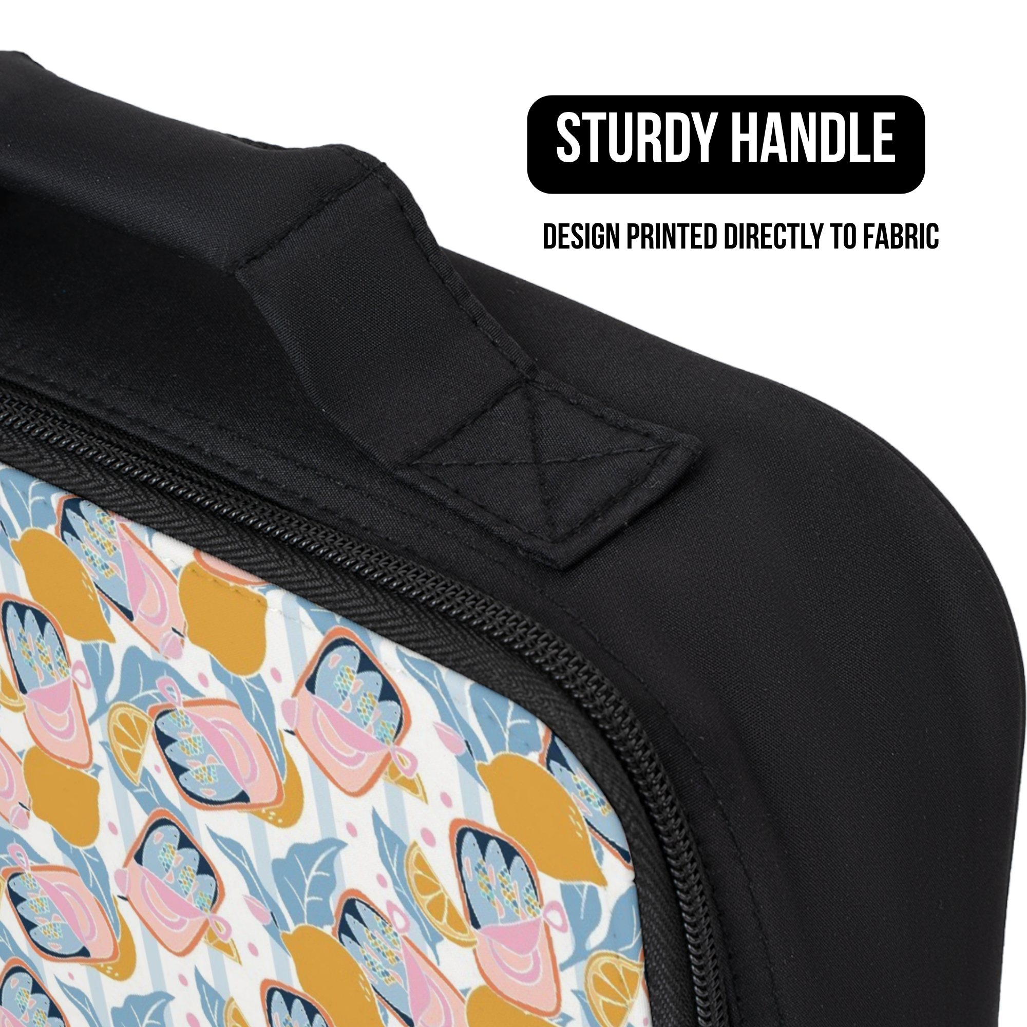 close up of lunch bag with a colorful sardine lemon patterned design on fabric and a black handle, labeled 'Sturdy Handle'.