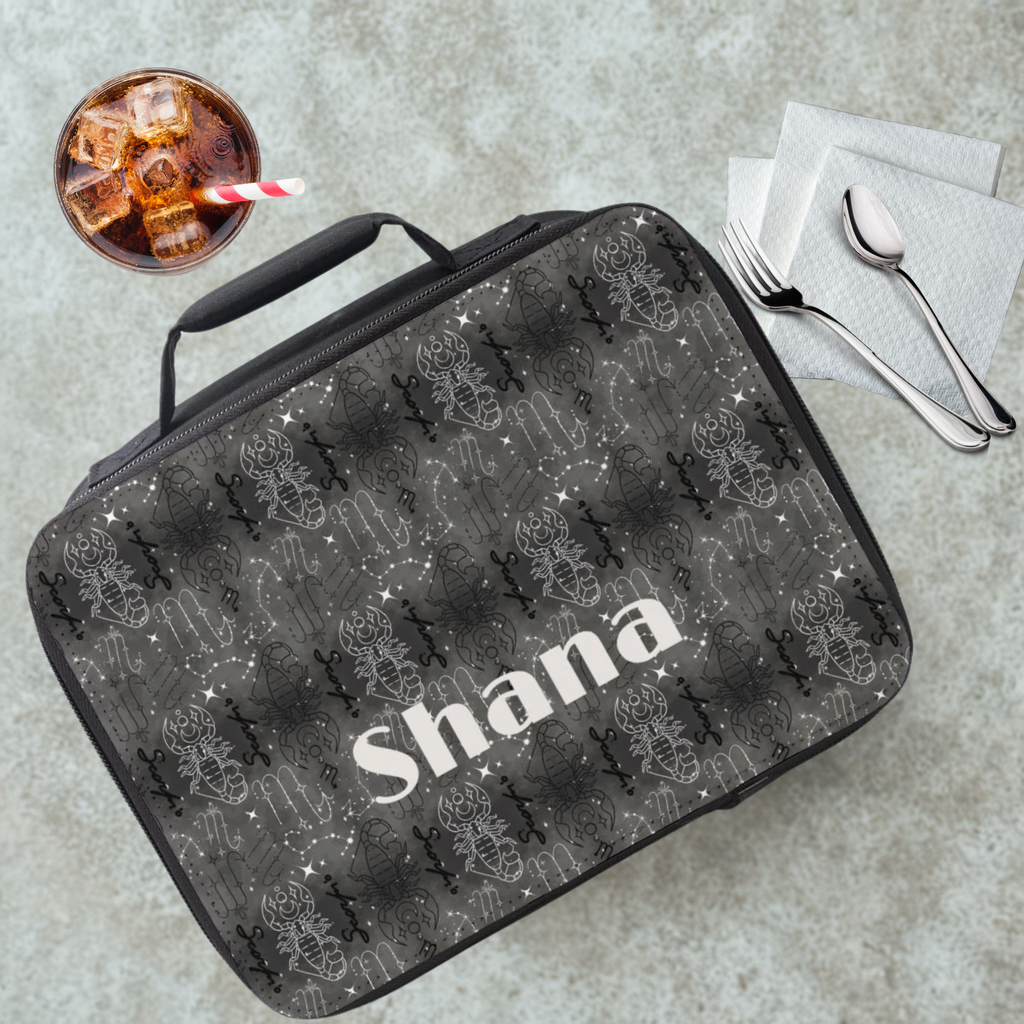 Scorpio insulated lunch bag with 'Shana' personalized name on a cafeteria table with a drink and utensils.