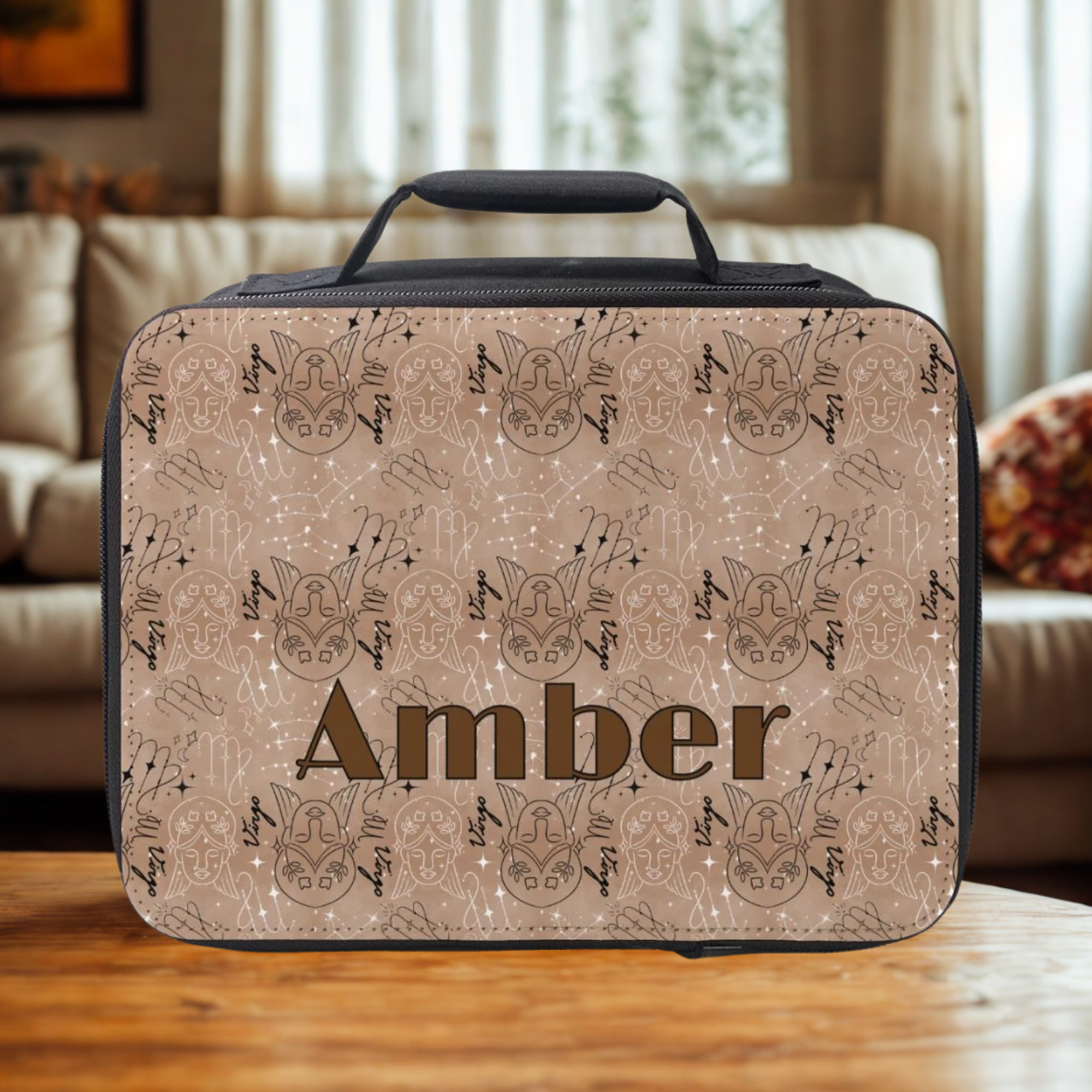 Virgo zodiac pattern design insulated lunch bag with 'Amber' custom text on a wooden living room table.