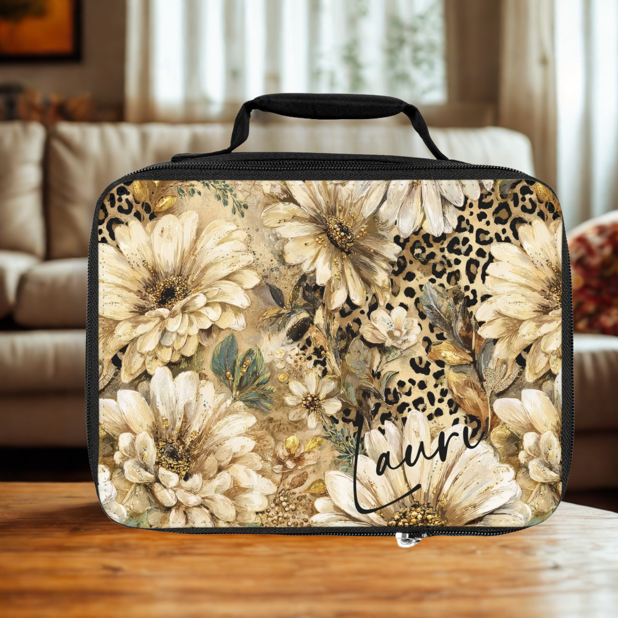 Floral and leopard print patterned lunch bag on a wooden surface with a blurred indoor background