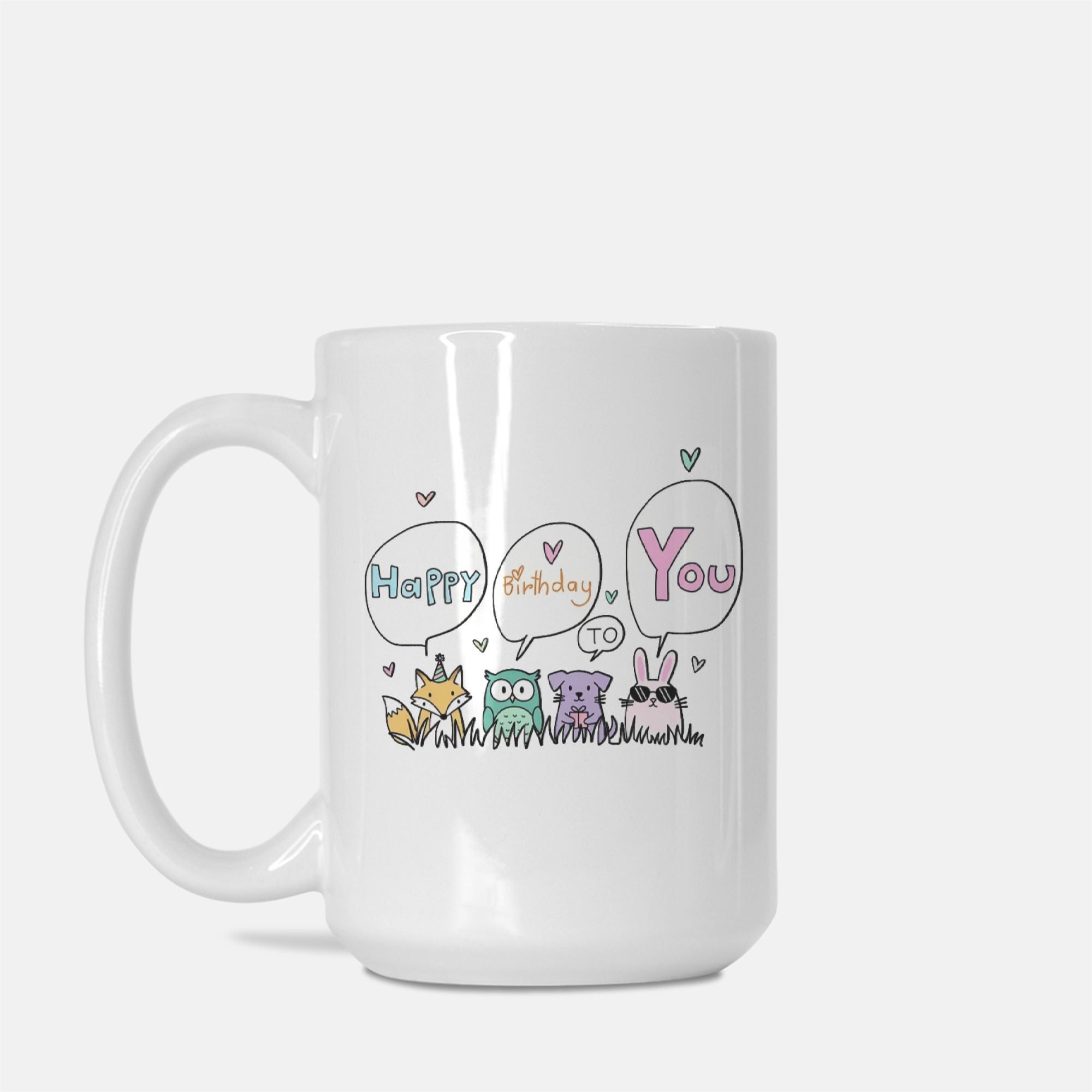 White mug with cartoon animals and 'Happy Birthday to you' text on a white background