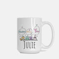 White mug with cartoon animals and text 'Happy Birthday You' to Julie on a white background