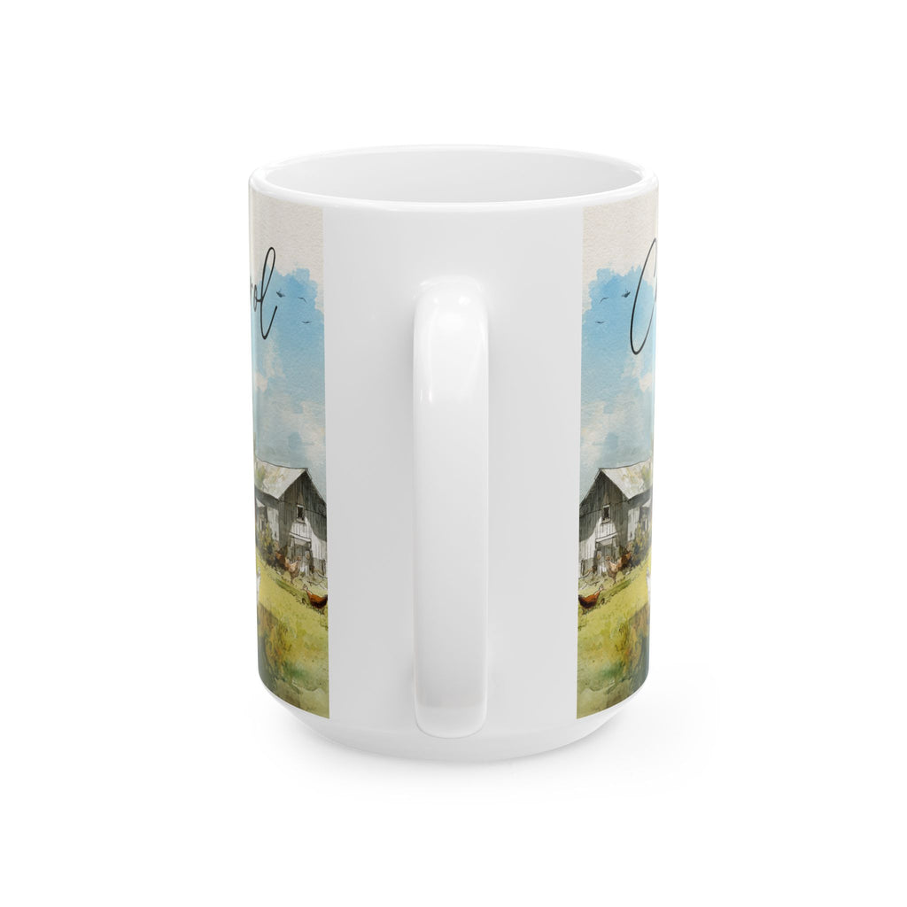 White mug with a scenic design of a house and trees on a white background