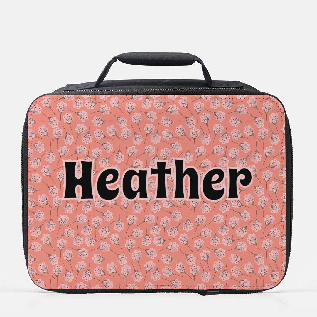 Pink floral patterned lunch bag with personalized name 'Heather'  on a white background