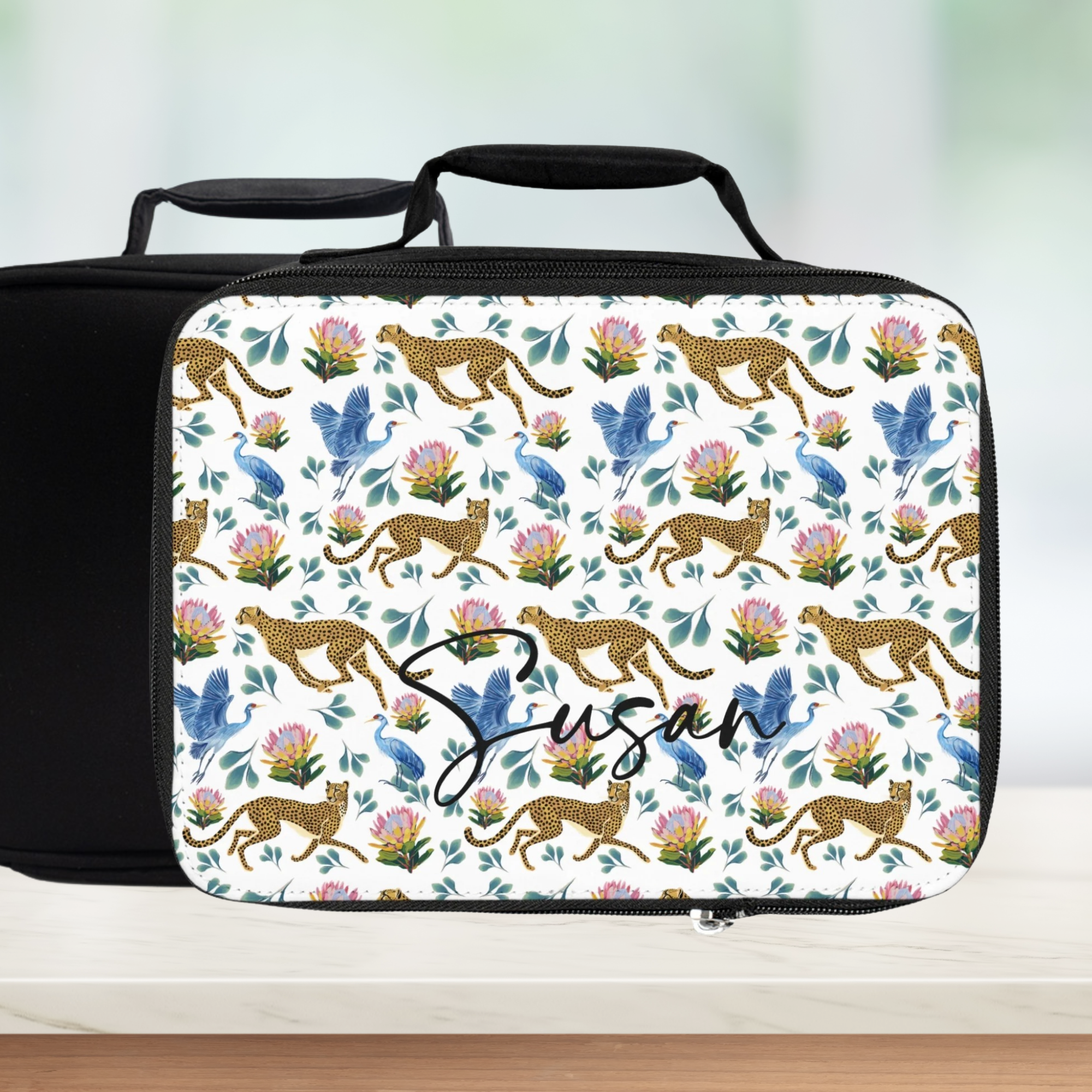 Floral and animal patterned lunch bag with 'Susan' personalized text on a light background