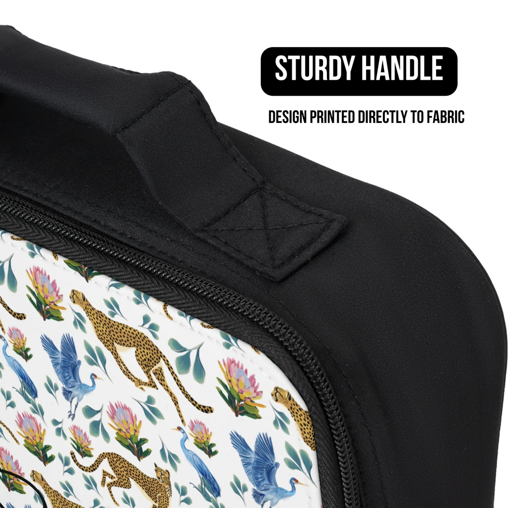 Close-up of a lunch bag with a colorful cheetah, bird, and floral pattern and a sturdy handle.