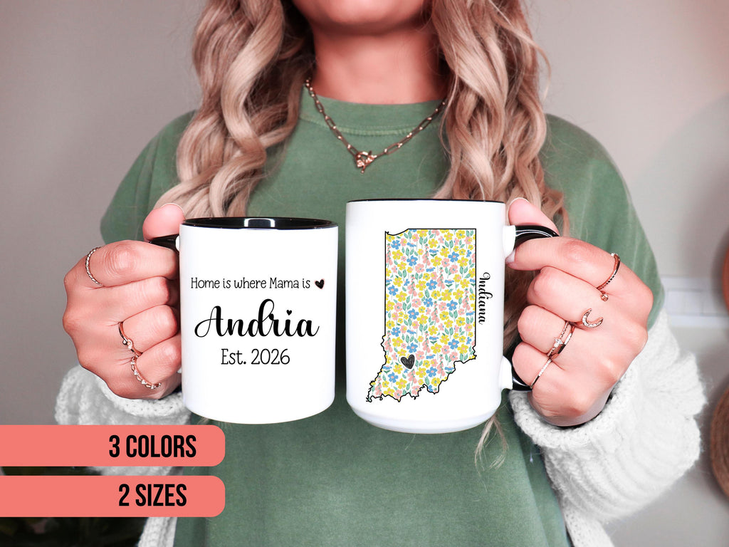 Person holding two mugs with personalized state design and custom text.