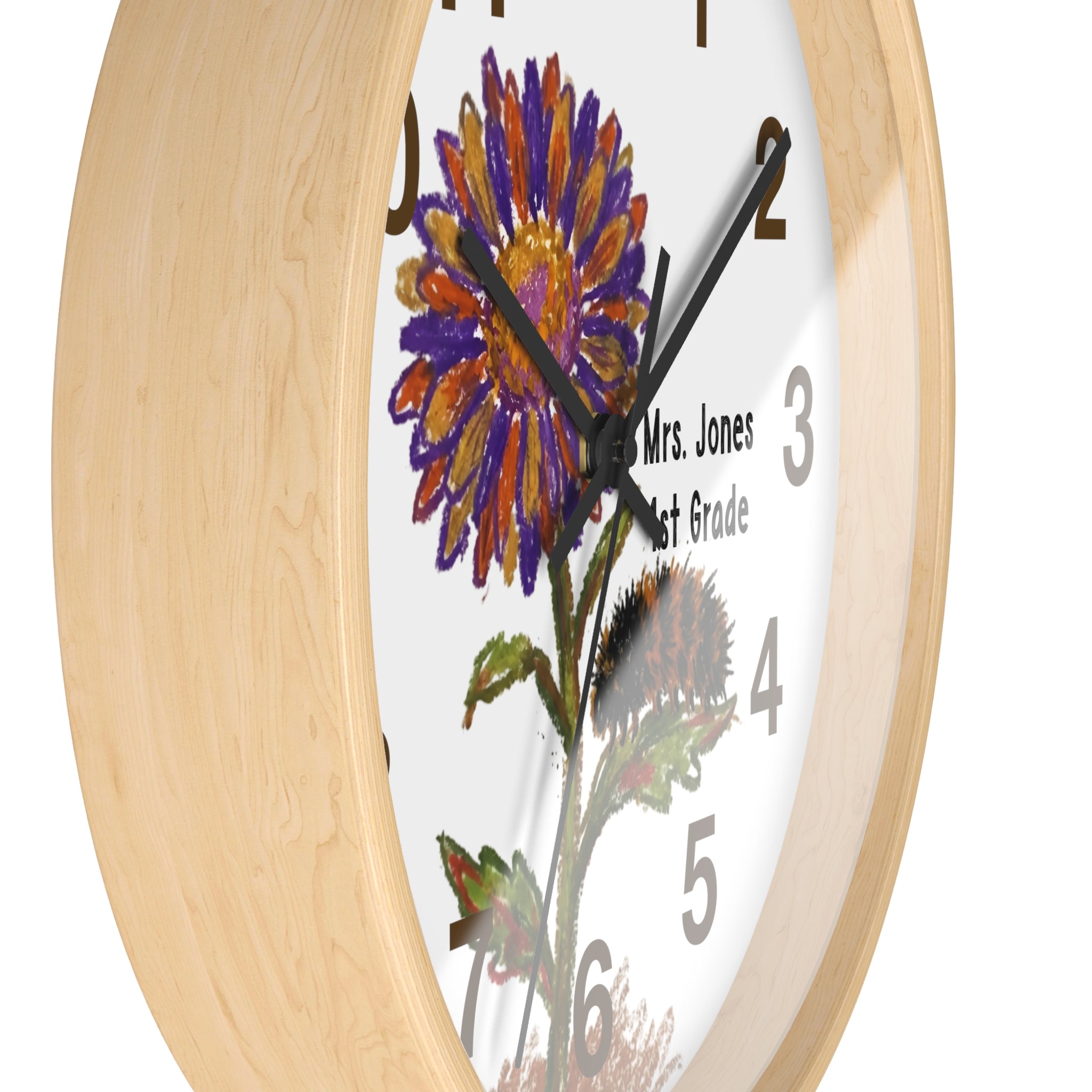 Wall clock with floral design and 'Mrs. Jones 1st Grade' text on a white background