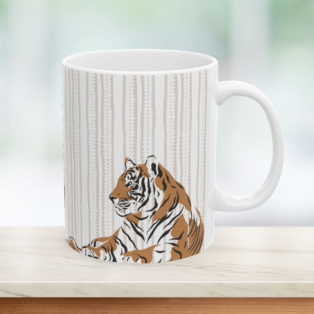 White mug with a tiger design on a wooden surface