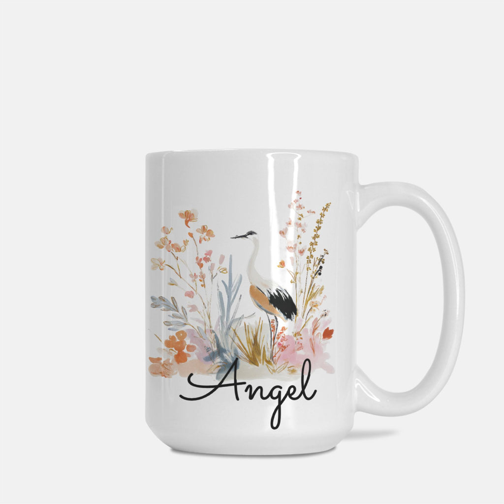 White mug with floral design and 'Angel' text on a white background