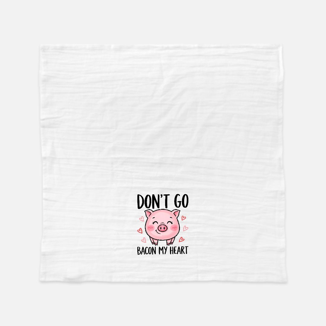 White tea towel with a pink pig graphic and text on a white background