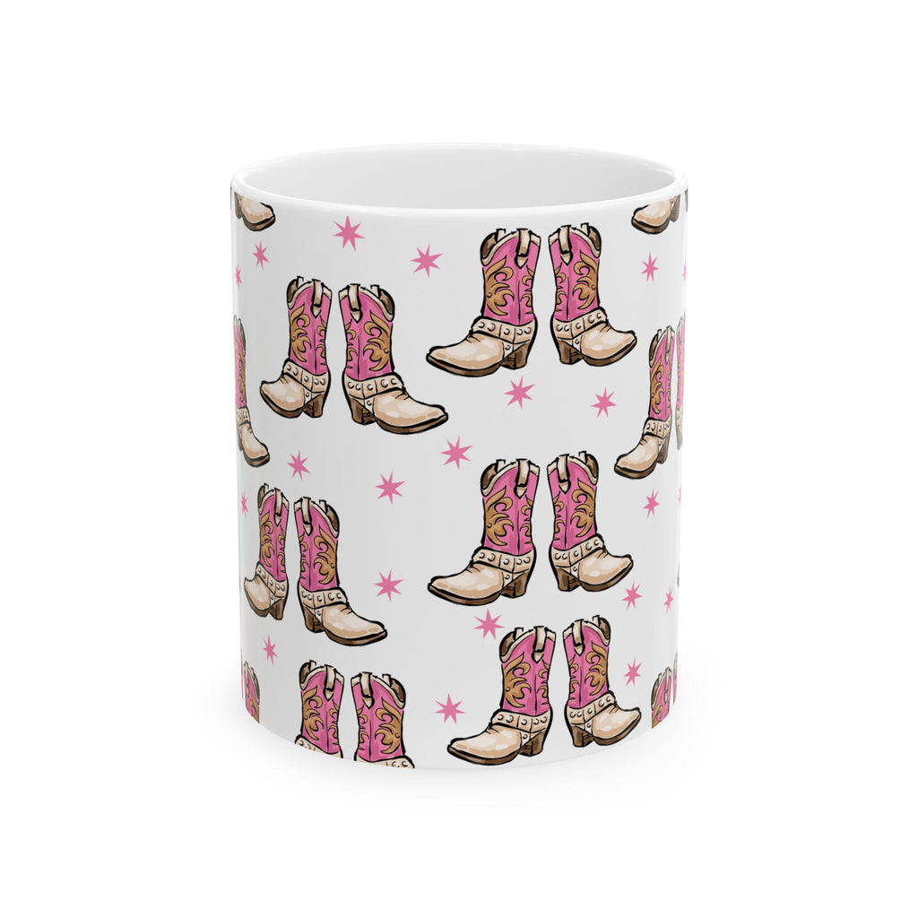 Front of 11oz Ceramic mug with pink cowboy boots design on a white background