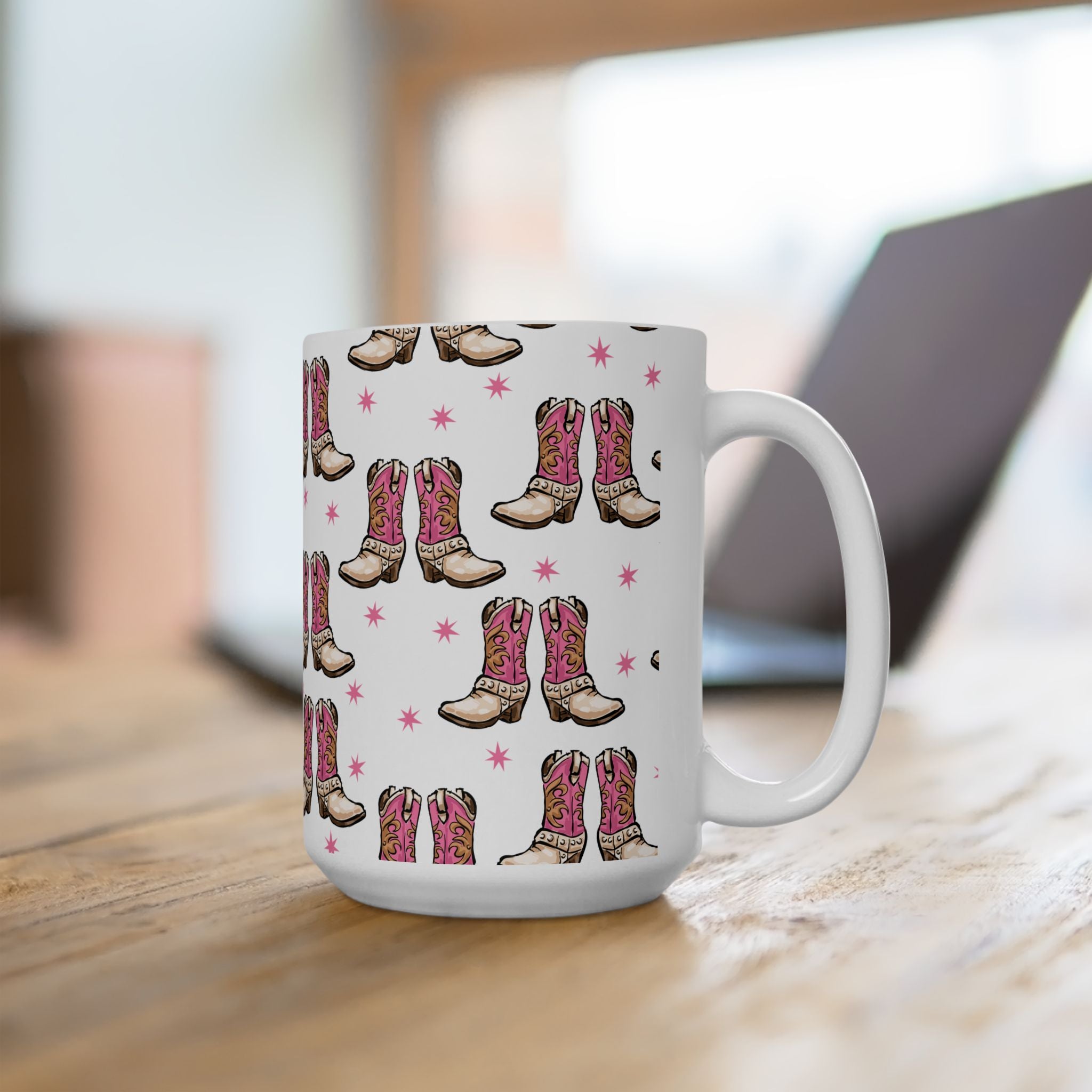 15 oz White mug with pink and brown cowboy boot pattern on a wooden surface