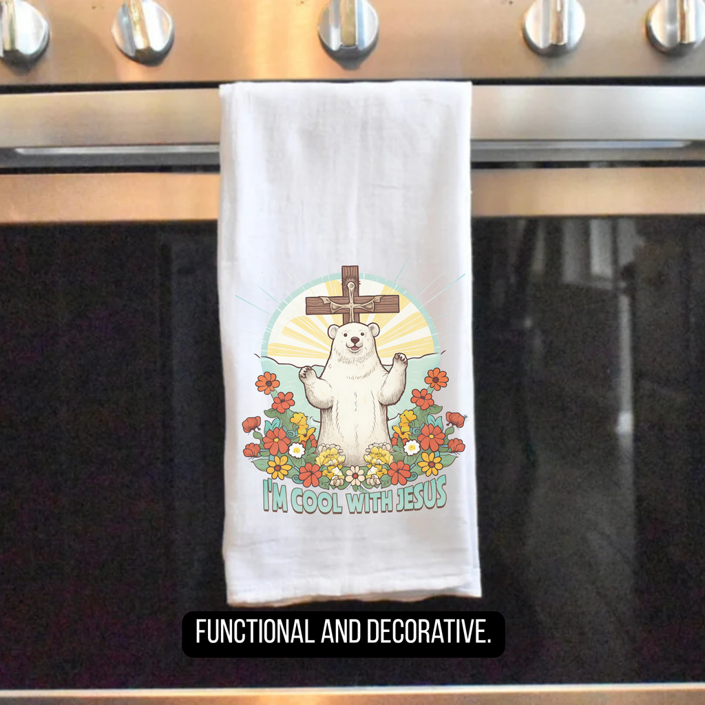 Tea towel with a bear graphic and text 'I'm Cool With Jesus' hanging on a stove handle