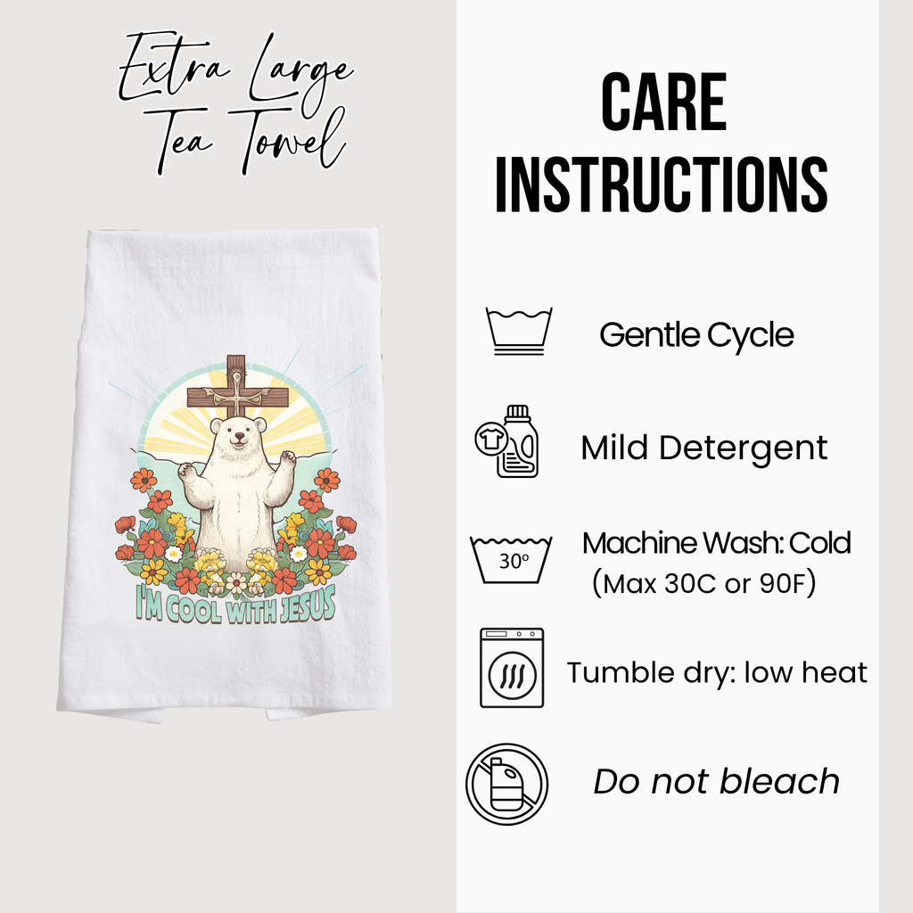 Tea towel with bear and cross design and care instructions on a white background