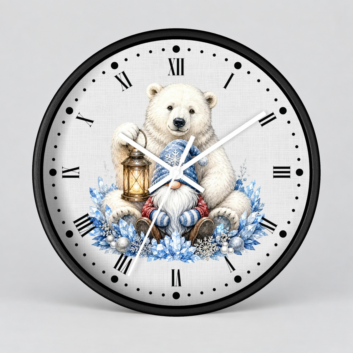 A round wall clock with a black frame and a white face featuring an illustration of a polar bear sitting in a sleigh surrounded by blue floral wreaths and snowflakes, with black Roman numerals and white clock hands.