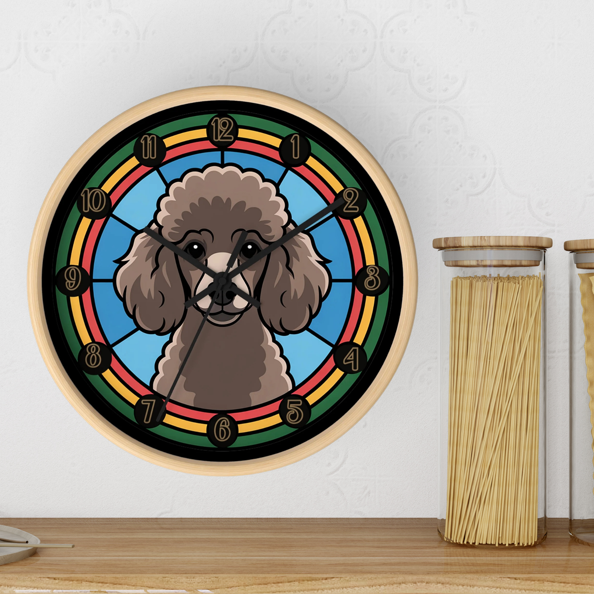 Round wood wall clock with a Poodle dog illustration on a white wall next to jars of pasta for size comparison