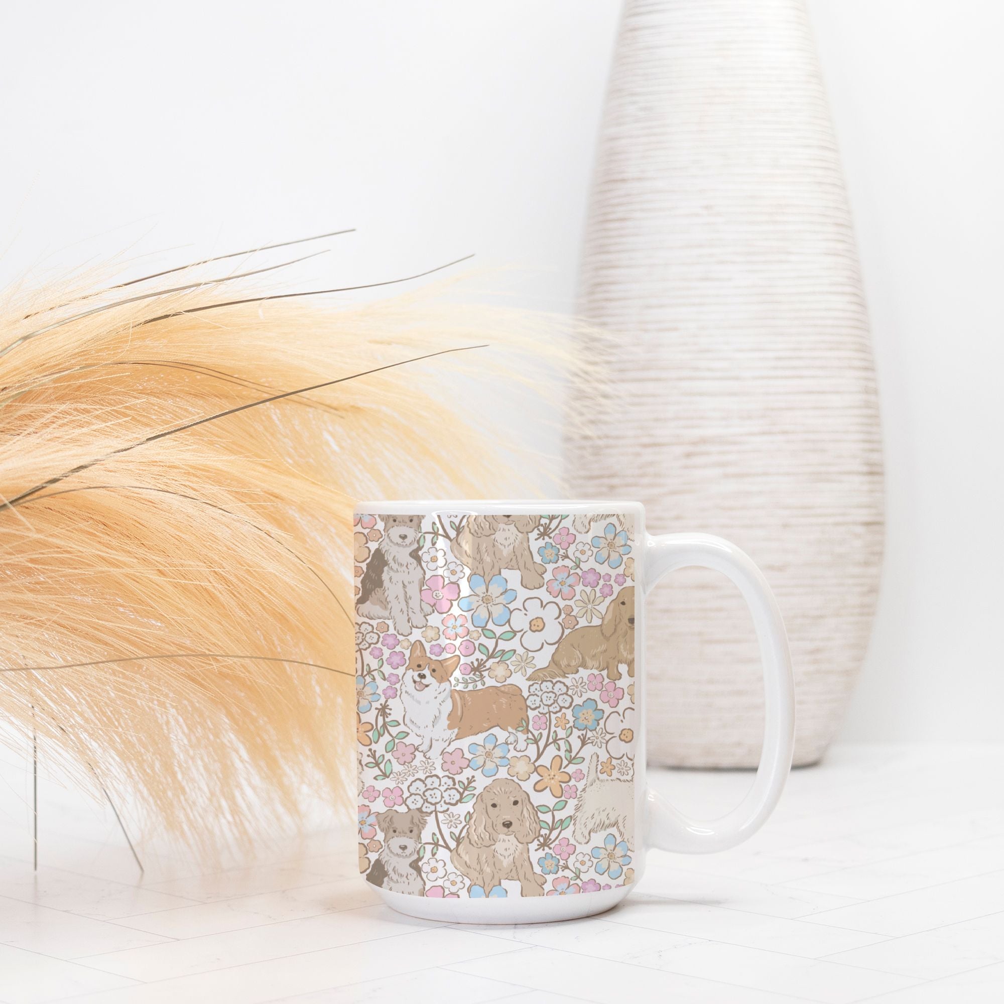 Mug with a floral and dog pattern on a white surface with decorative elements.