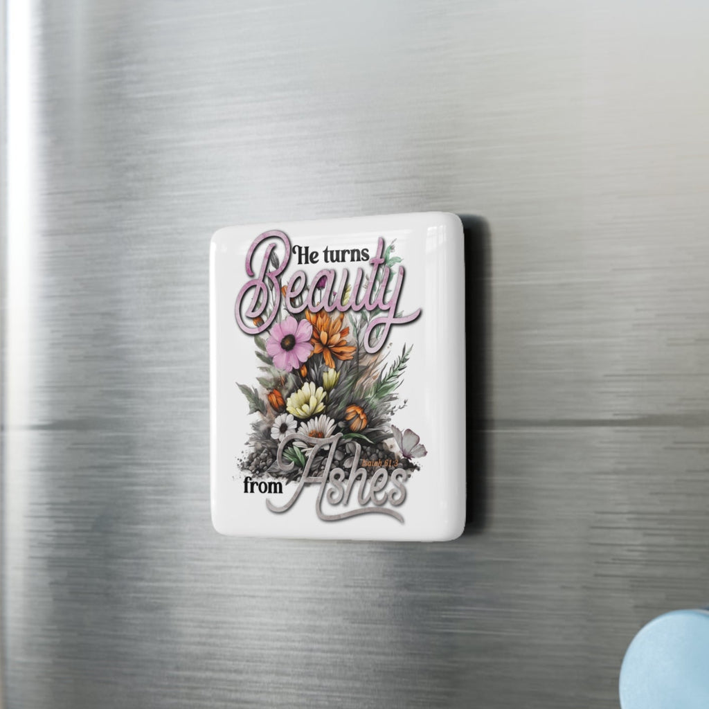 Decorative magnet with floral design and text on a refrigerator