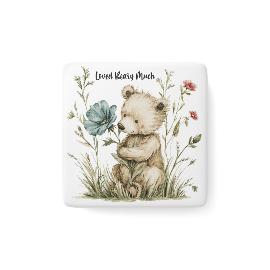 Square ceramic magnet with a teddy bear holding flowers and the text 'Loved Beary Much' on a white background.