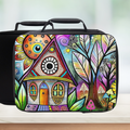 Colorful art design on a black lunch bag with a blurred background