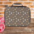 Lunch bag with a hand drawn dog pattern on a wooden surface and brick wall background