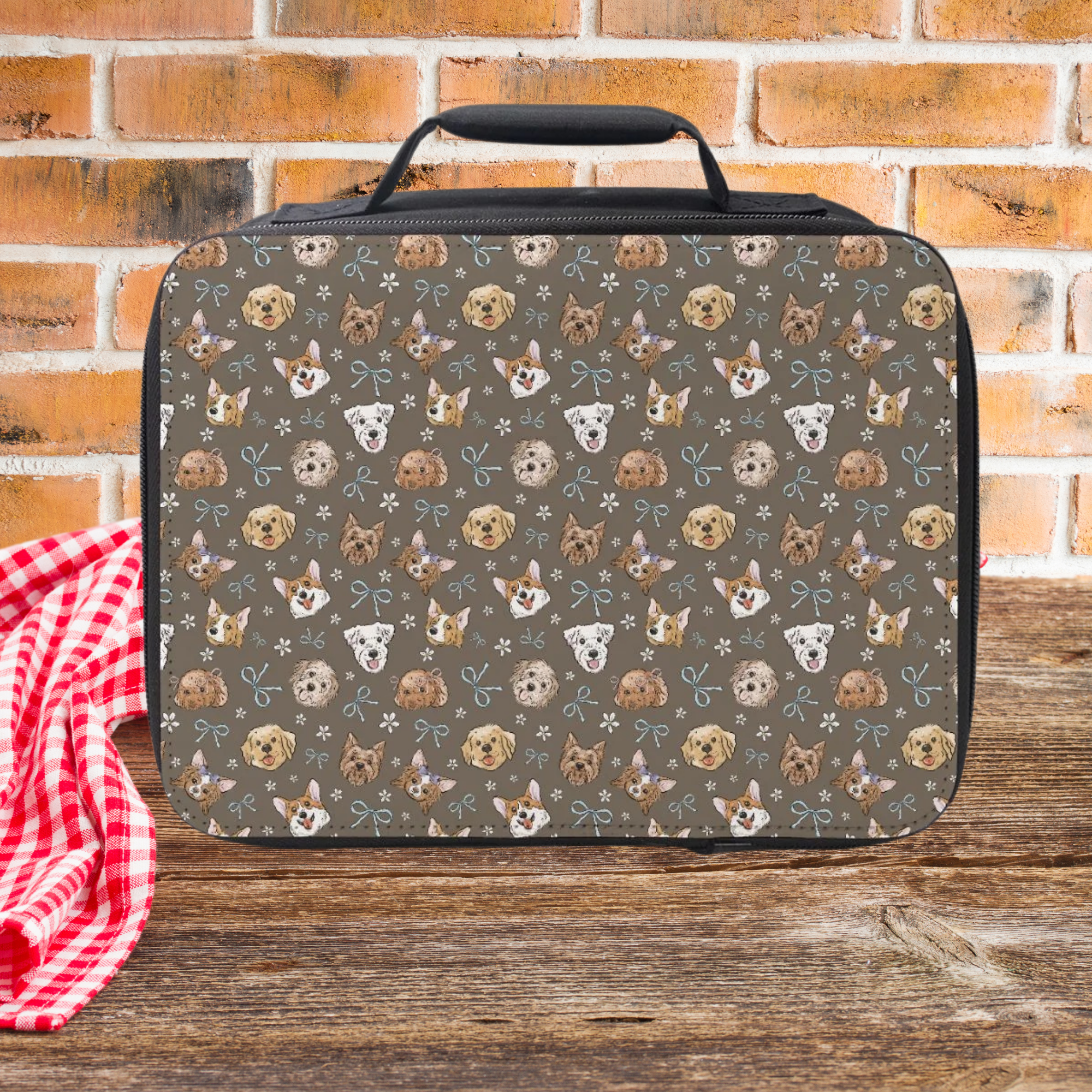 Lunch bag with a hand drawn dog pattern on a wooden surface and brick wall background
