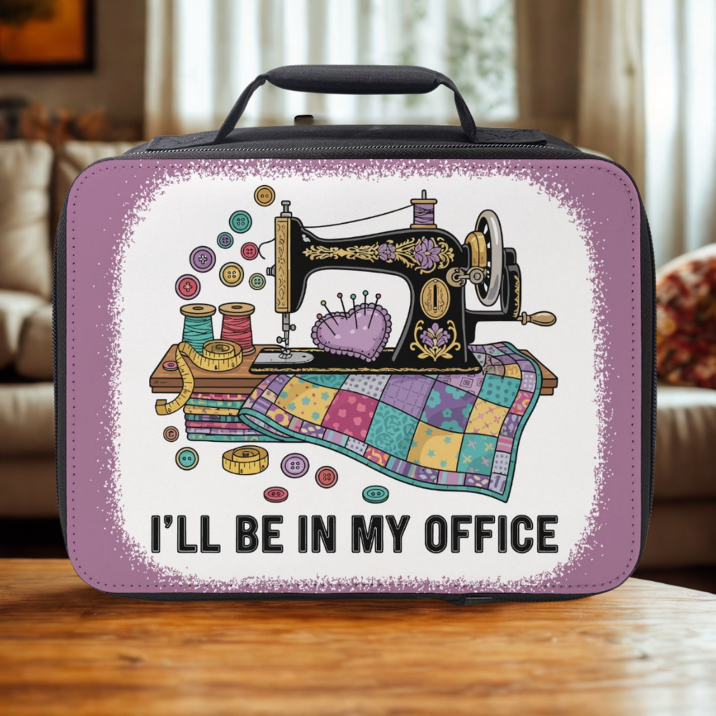 Lunch bag with a sewing machine design and text 'I'll be in my office' on a wooden coffee table.