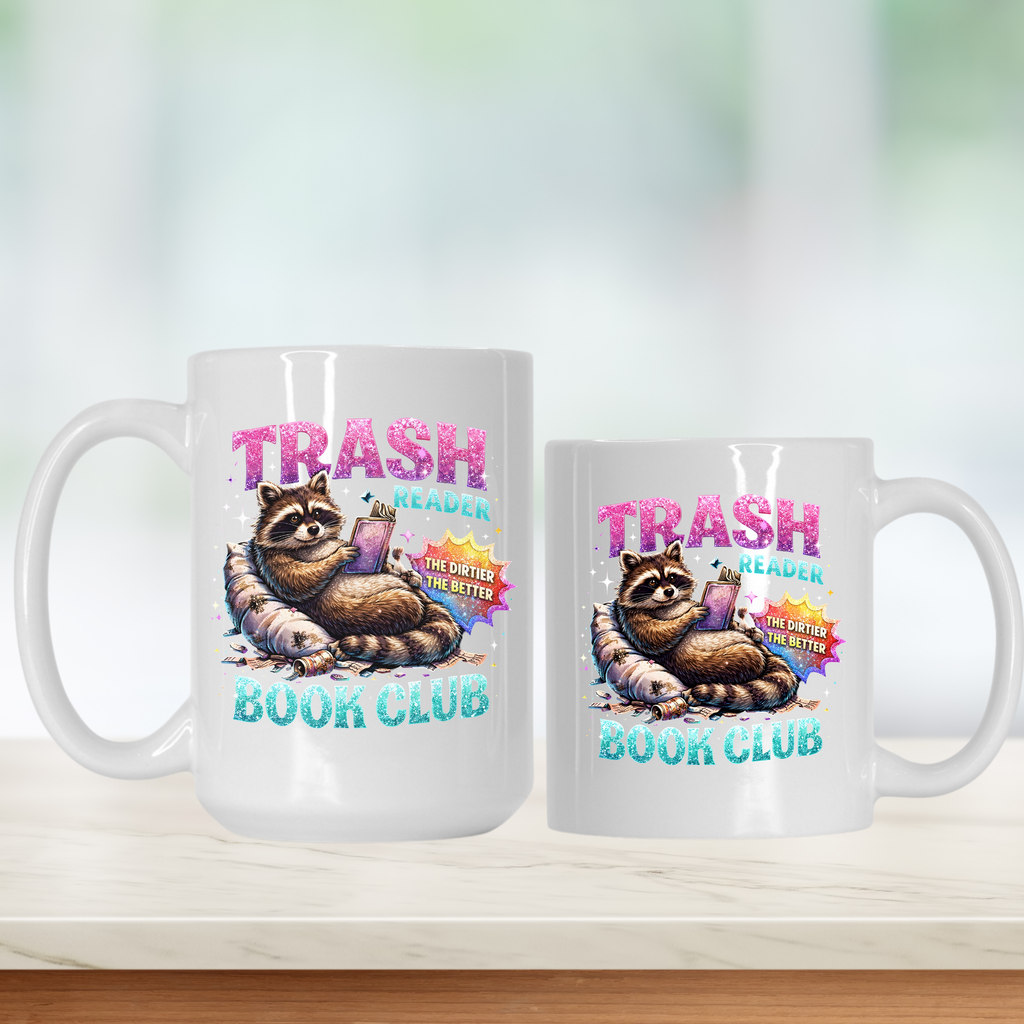 Two mugs with a raccoon design and 'Trash Reader Book Club' text on a white background.