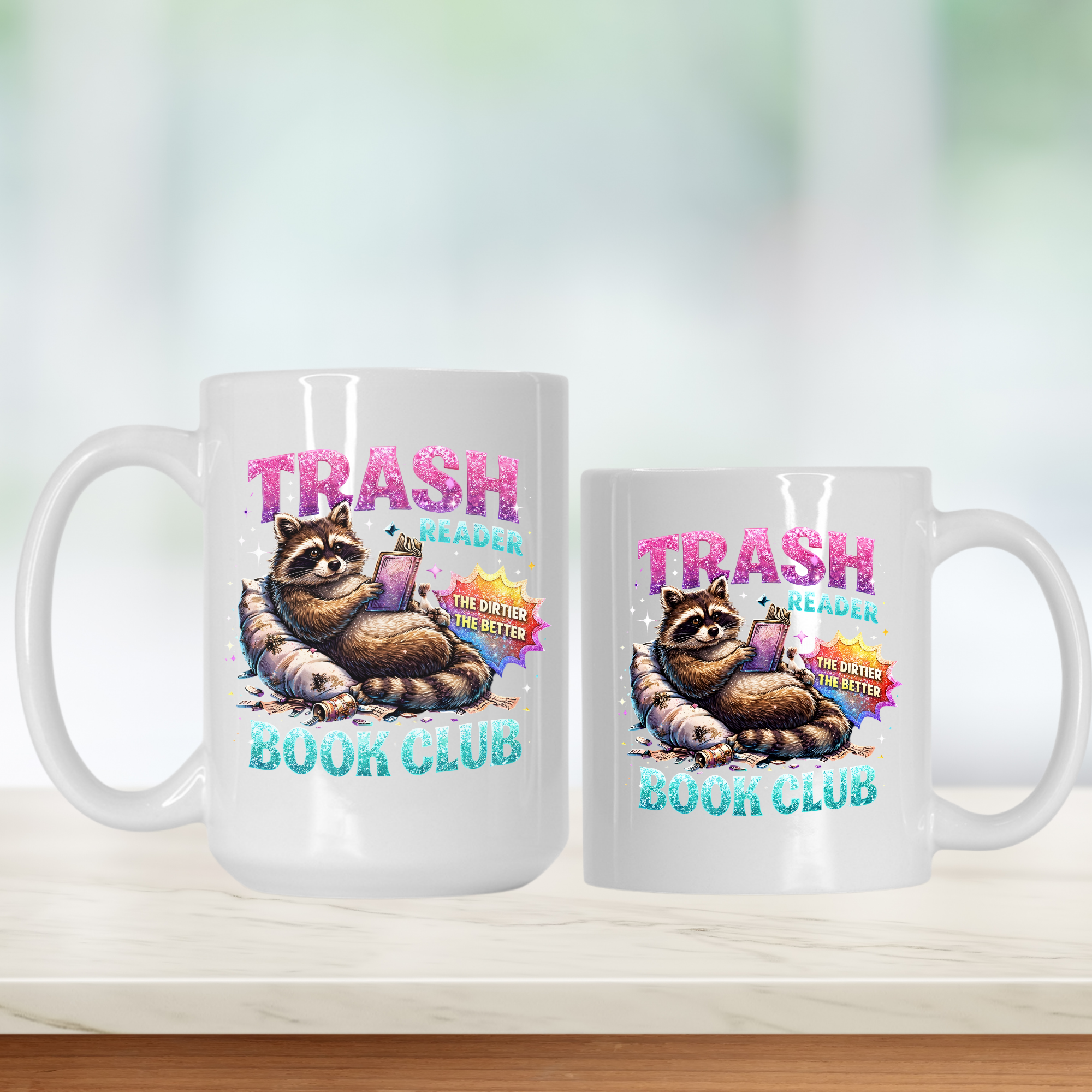 Two mugs with a raccoon design and 'Trash Reader Book Club' text on a white background.