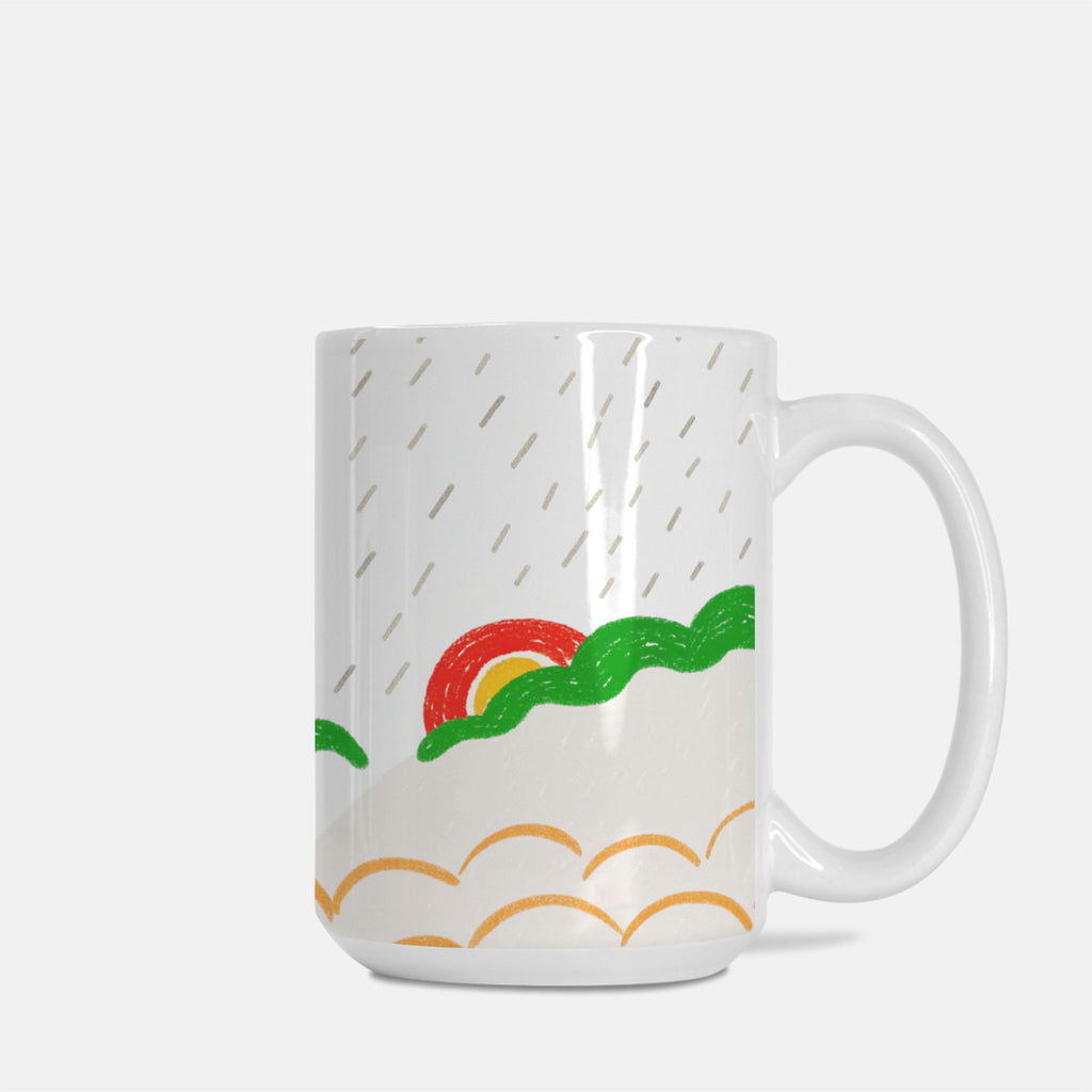 White mug with colorful rainbow and cloud design on a white background