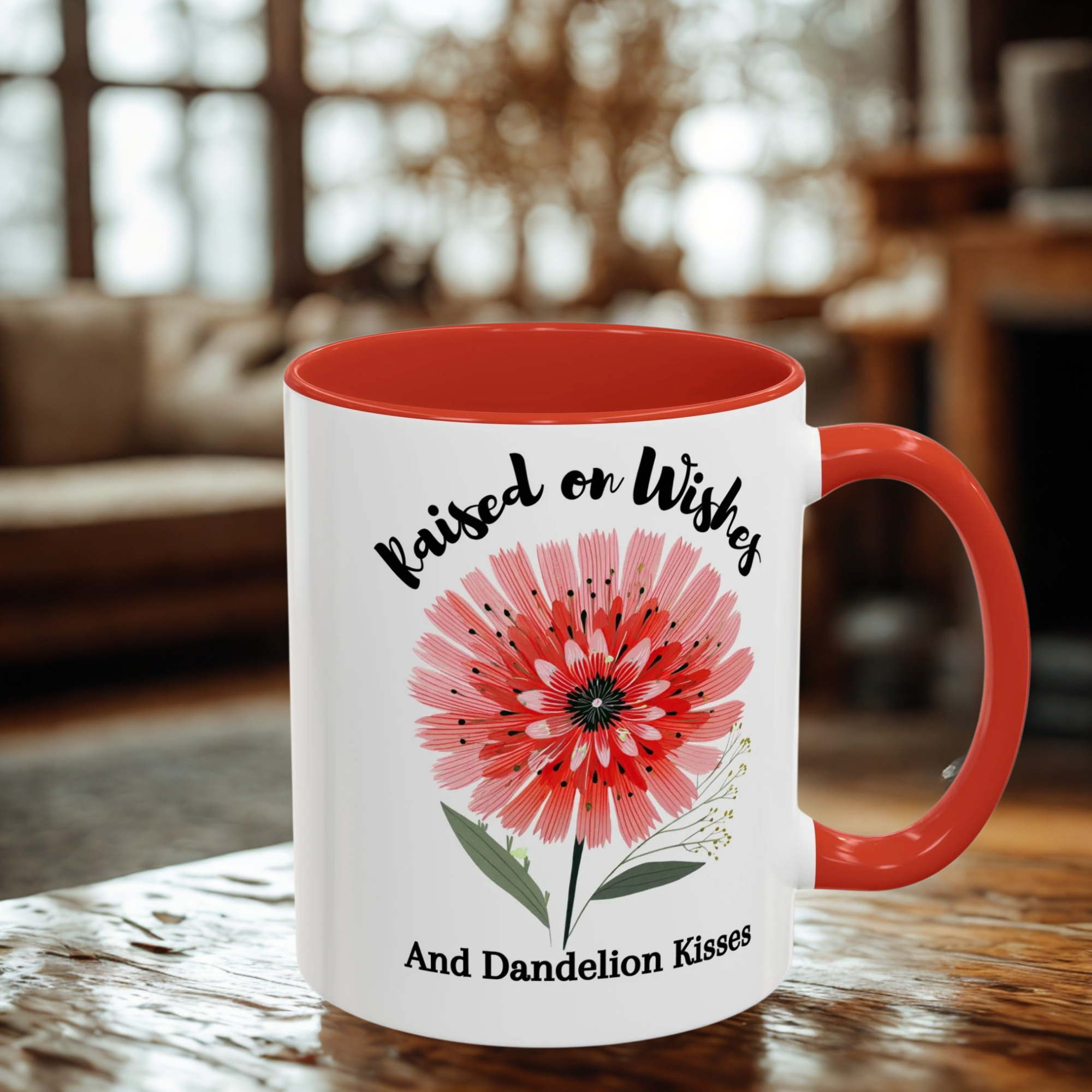 11oz mug with red interior and handle, featuring a dandelion illustration and text, on a wooden surface.