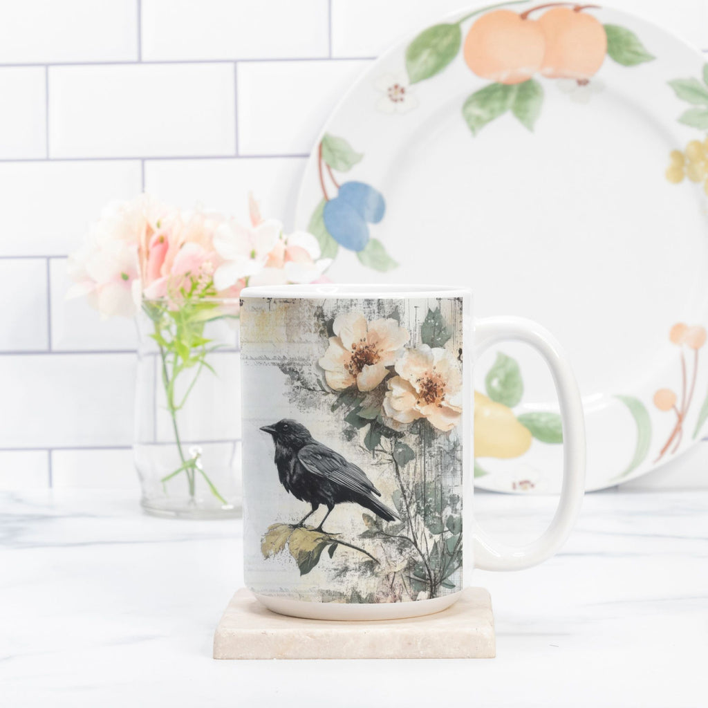 Mug with floral and bird design on a white surface with a blurred background