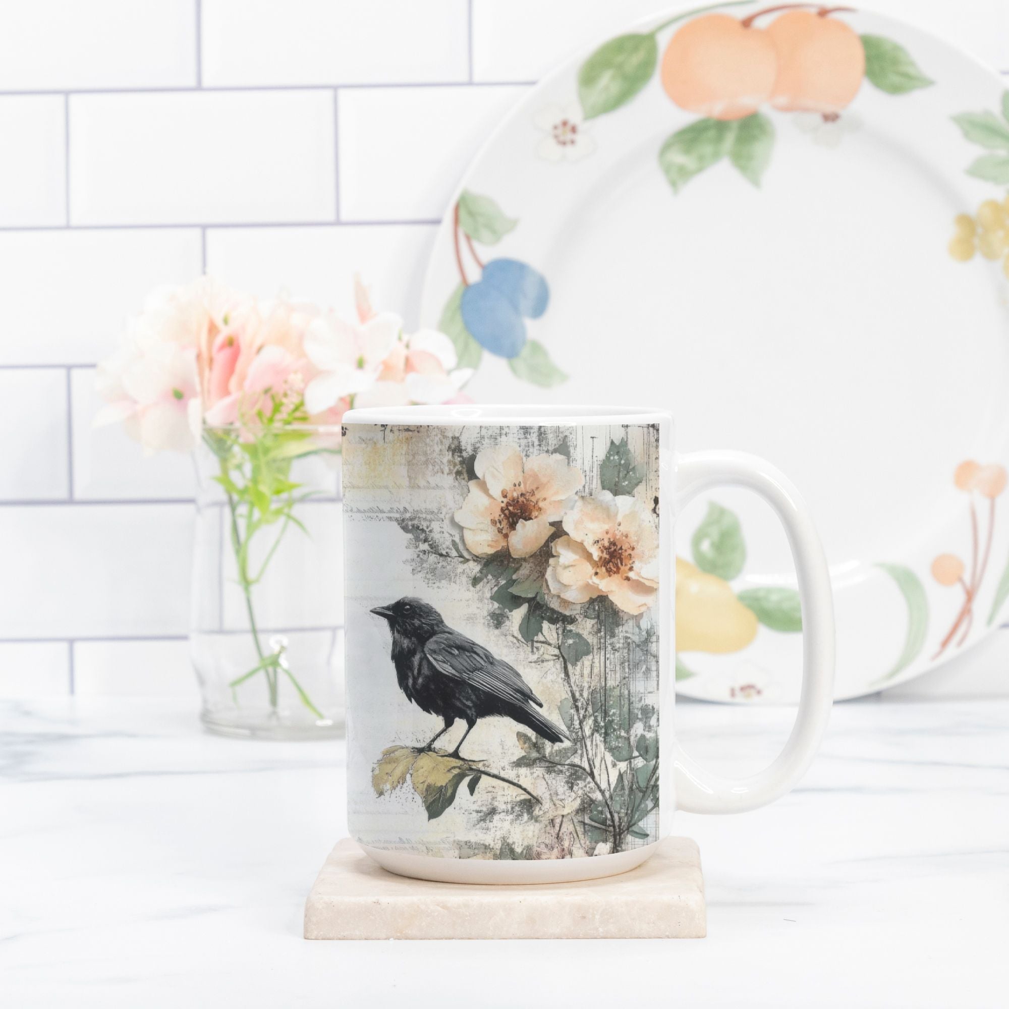 Mug with floral and bird design on a white surface with a blurred background