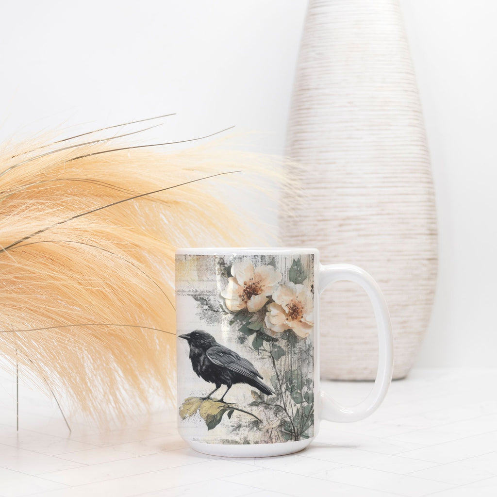Mug with a bird and floral design on a white surface with decorative elements.
