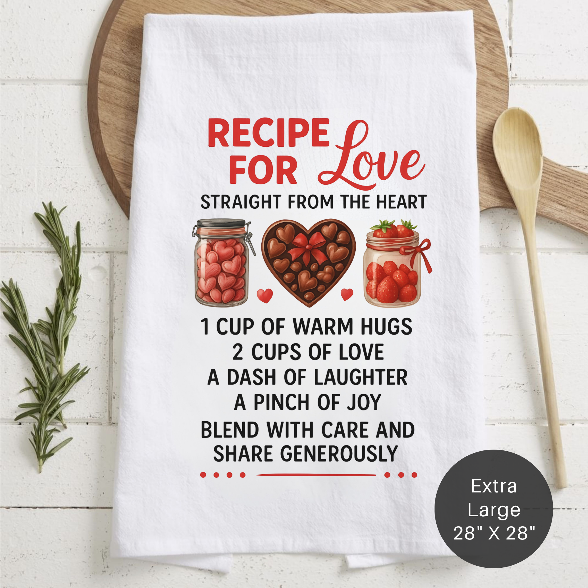 Kitchen towel with 'Recipe for Love' text and graphics on a wooden surface.
