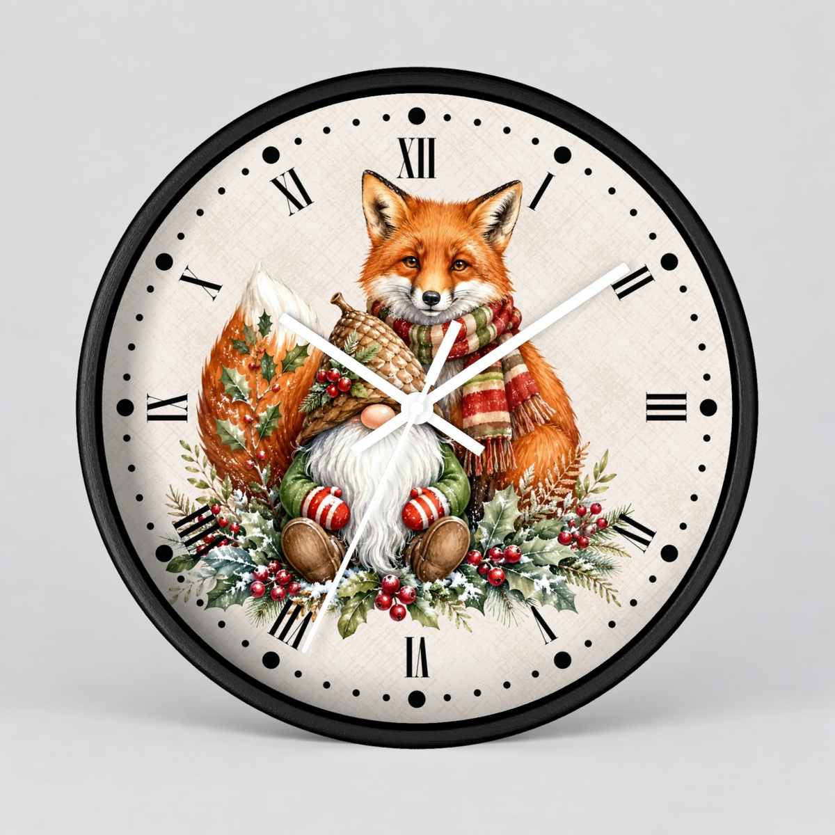 A round wall clock with a black frame and a cream-colored face featuring an illustrated orange fox wearing a red-and-green striped scarf, surrounded by greenery and red berries, with black Roman numerals and white clock hands.