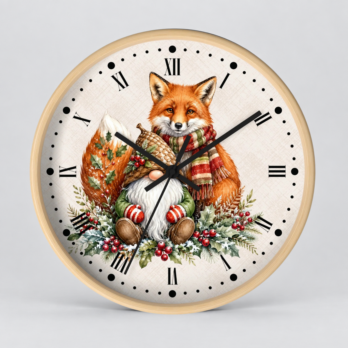 A round wall clock with a light wood frame and a winter fox illustration on the face. The design shows an orange fox wearing a red-and-cream striped scarf, sitting among green foliage, red berries, pinecones, and striped ornaments, with black Roman numerals and black clock hands on a light gray background.