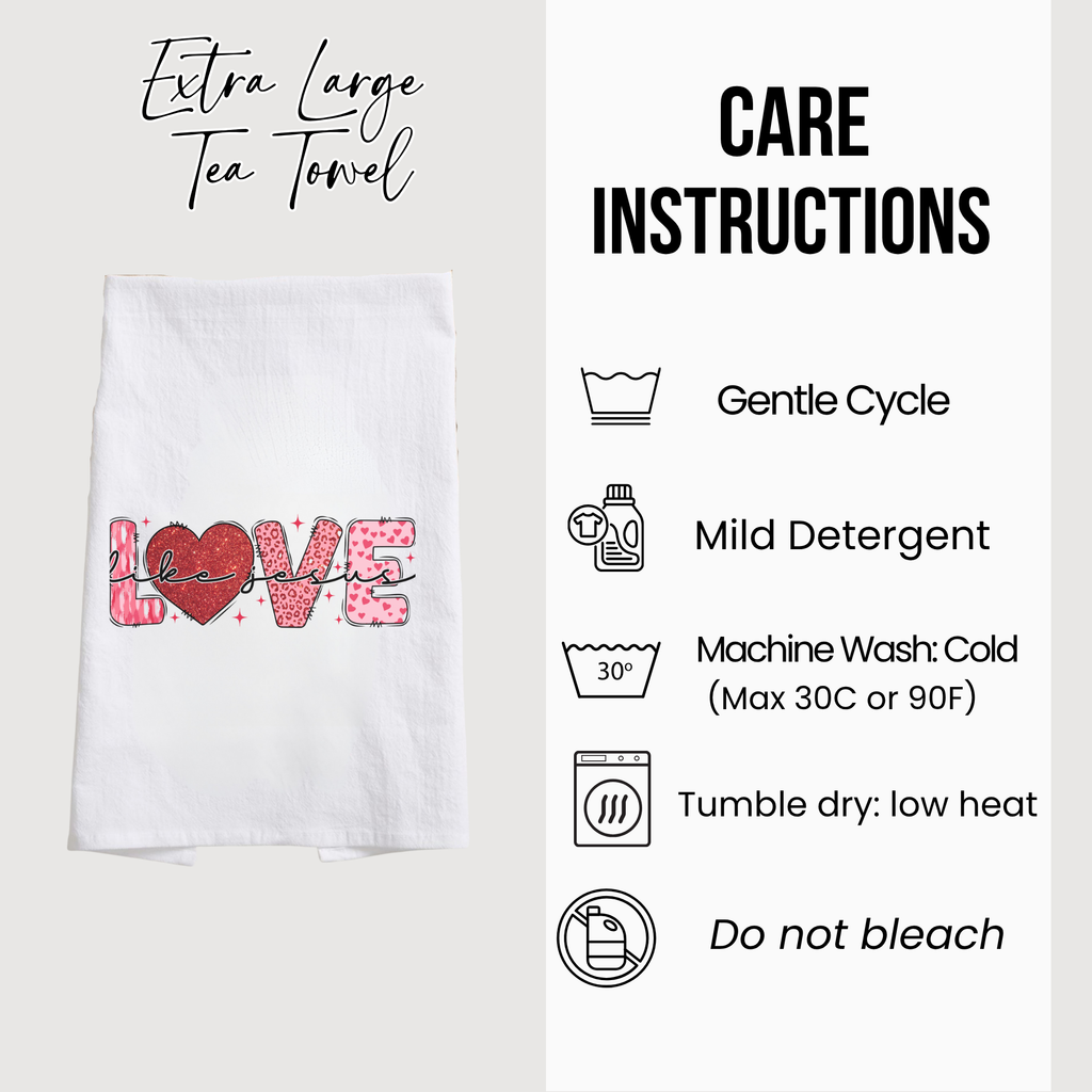 White tea towel with 'LOVE' design and care instructions on a white background