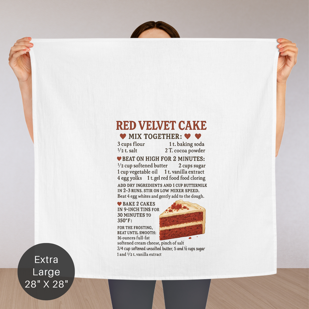 Person holding an extra large tea towel with a  Red Velvet Cake recipe with a slice of cake illustration.
