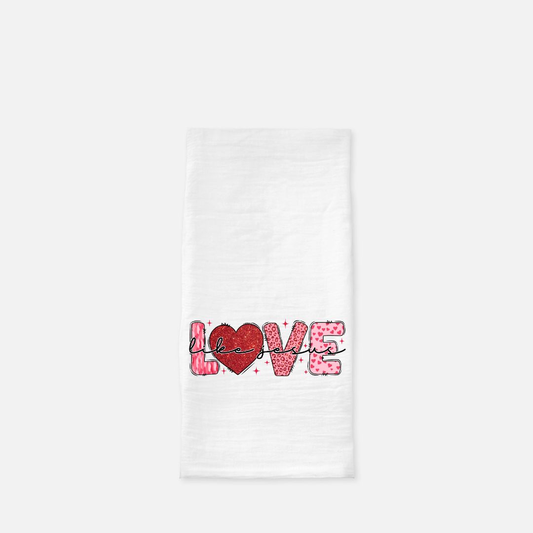 White tea towel with 'LOVE Like Jesus' text and red heart design on a white background