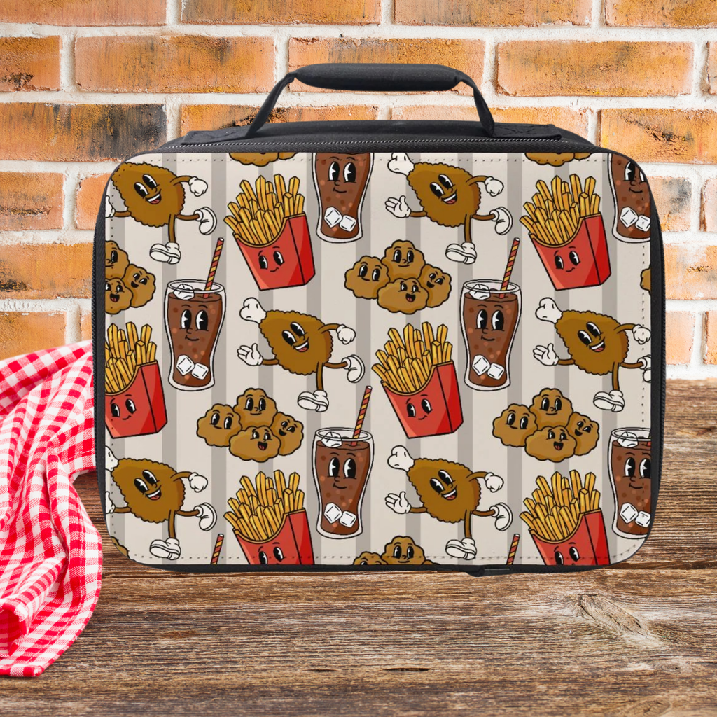  insulated lunch bag with cartoon fast food design on a wooden picnic table with a brick wall background