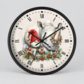 A round wall clock with a black frame and a cream-colored face featuring a festive illustration of a white rhinoceros and gnome wearing a red Santa hat and holiday garland, with black Roman numerals and hands on a light gray background.